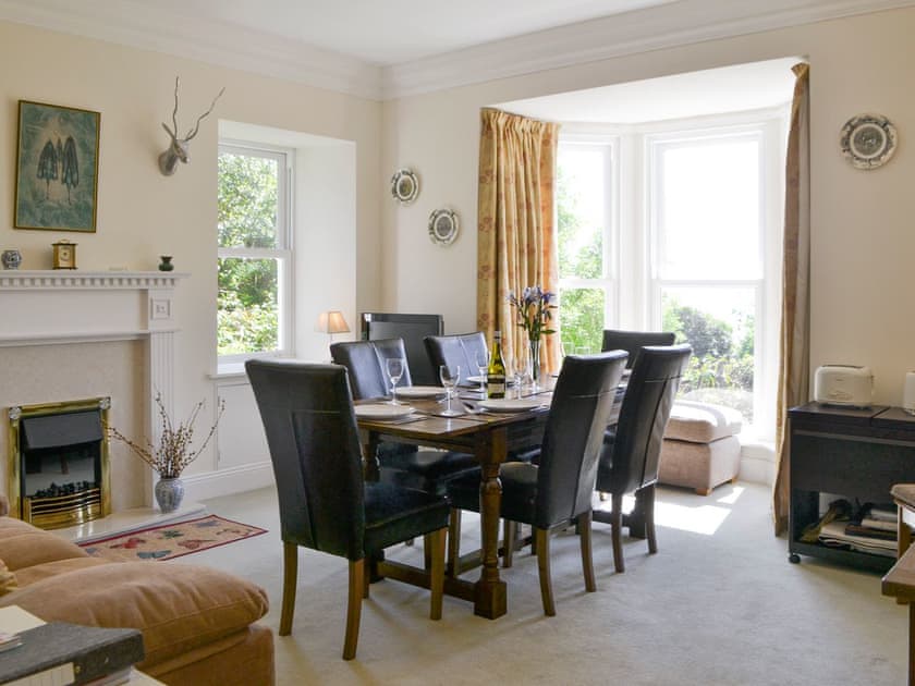 Spacious dining room with electric coal-effect fire | Fairview, Rockcliffe, near Dalbeattie