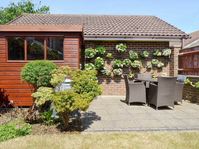 Paved patio with high quality outdoor furniture | Rosedene, Bembridge