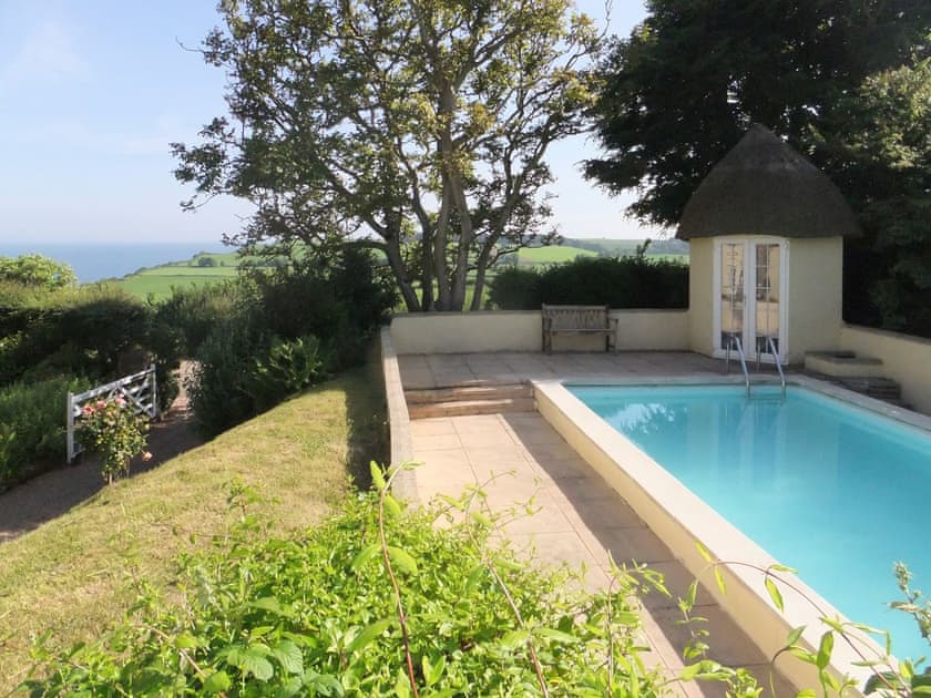 Luxurious swimming pool | Monks Thatch Cottage, Otterton