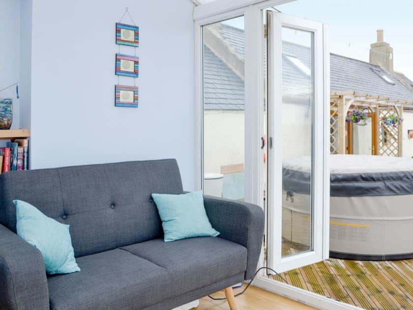 Comfortable seating in the conservatory | Sea Yonder, Buckie, near Cullen