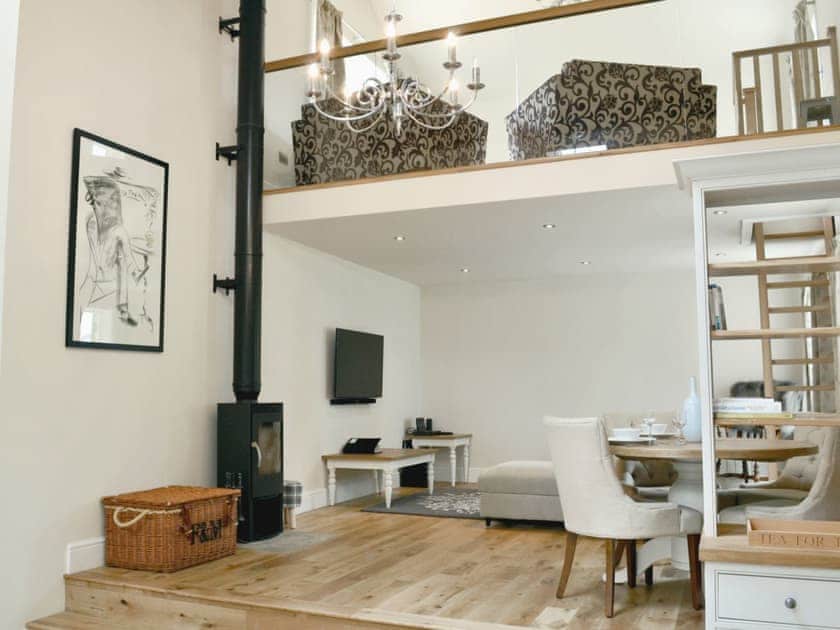 Well presented open plan living space with a wood burner | Stirton Burrow, Stirton, near Skipton
