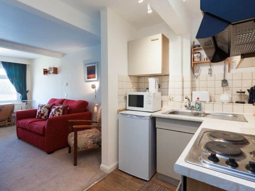 Compact kitchen area adjacent to the living area | Salcombe 33, Salcombe