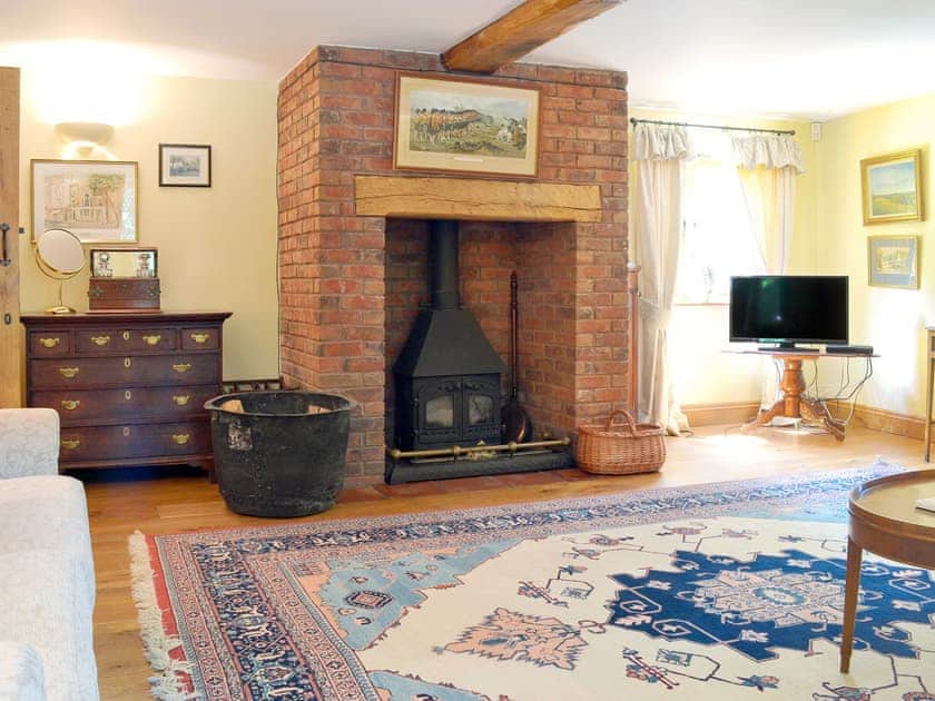 Spacious living room with wood burner | Mill Farmhouse - Maunsel House Estate Cottages, Bridgwater