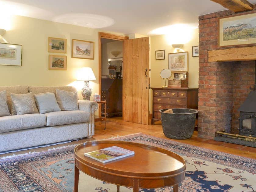 Living room with wood burner | Mill Farmhouse - Maunsel House Estate Cottages, Bridgwater