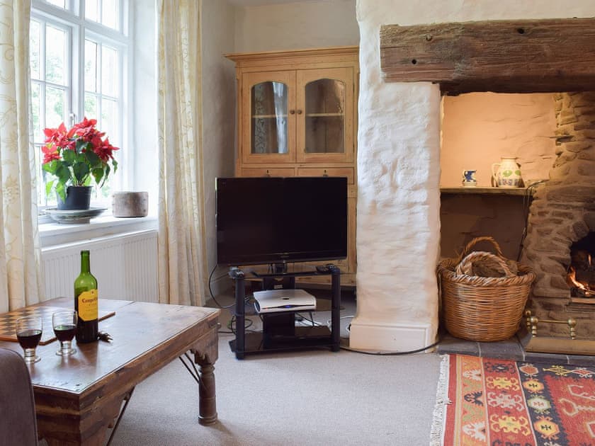 The living room boasts a grand fireplace | Lordship FarmhousePottery, Wolfscastle, near Haverfordwest