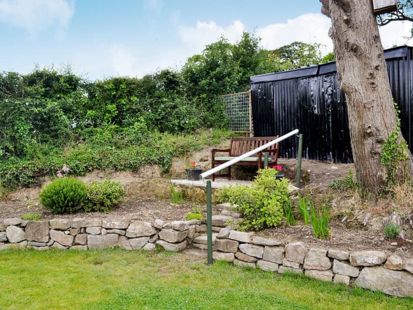  Enclosed lawned garden with patio and garden furniture | Dolfran Bach, Dolwen, near Betws-yn-Rhos, Abergele