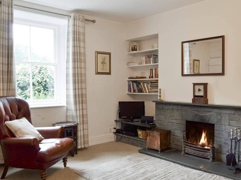 Warm and welcoming living room with feature fireplace | Roundhill Cottages 1, Grasmere