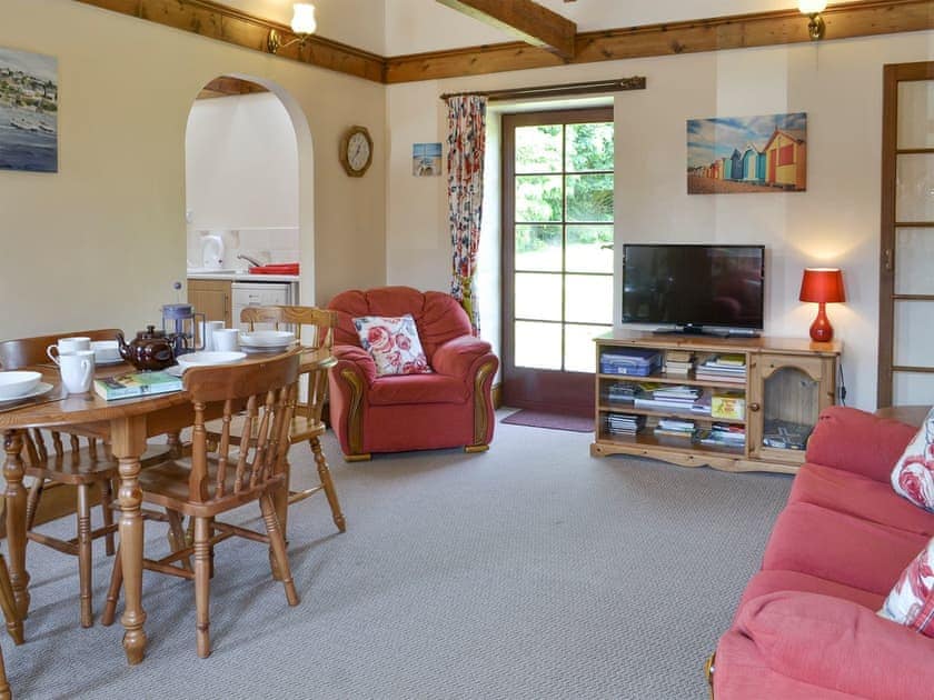 Welcoming living and dining room | Halcyon Cottage - Stowford Lodge Holiday Cottages, Langtree, near Great Torrington