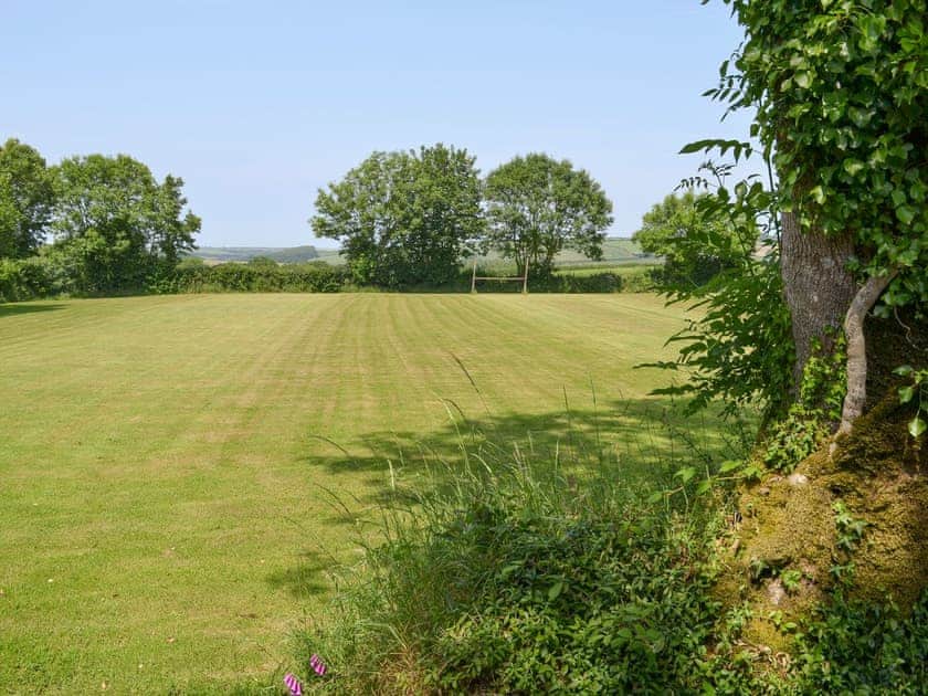 Additional lawned recreation area | Tarka’s Holt Log Cabin - Stowford Lodge Holiday Cottages, Langtree, near Great Torrington