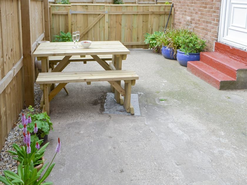 Additional outdoor seating within enclosed courtyard  | Naters Apartment, Whitley Bay, near Cullercoats