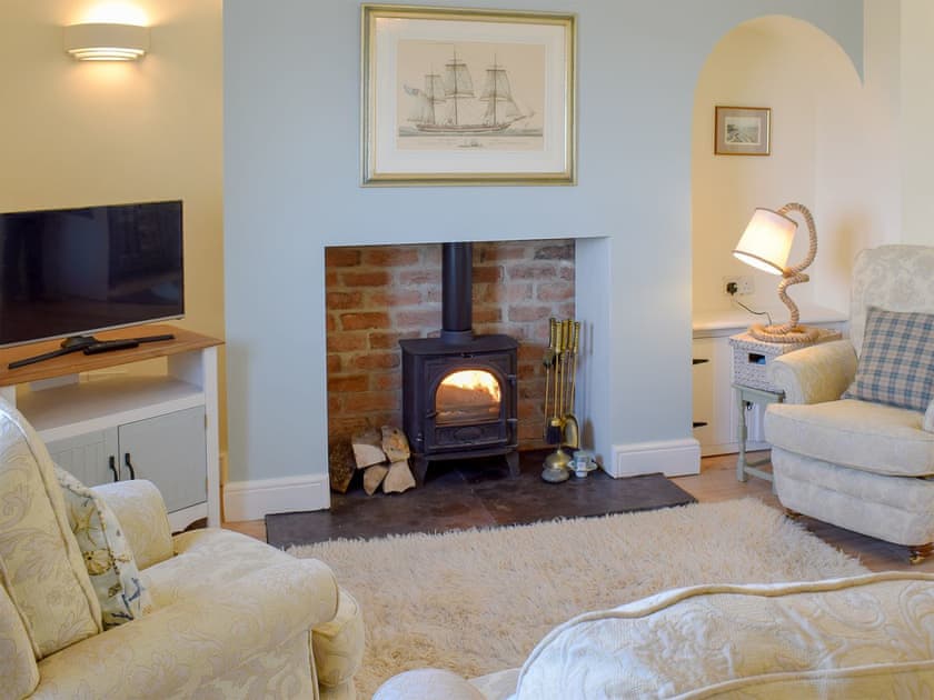 Cosy living area with wood burner | Cleveland Way Cottage, Skinningrove, near Whitby