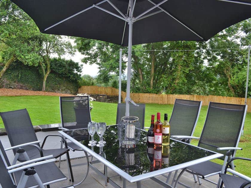 Enjoy an alfresco meal on the lovely patio | Maes yr Onnen, Abercych, near Cardigan
