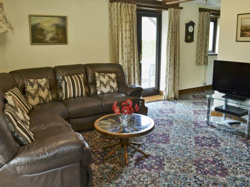 Homely living room with wood burner | Stowford Barton Cottage - Swallows Nest - Stowford Barton Cottages, Stowford, Okehampton