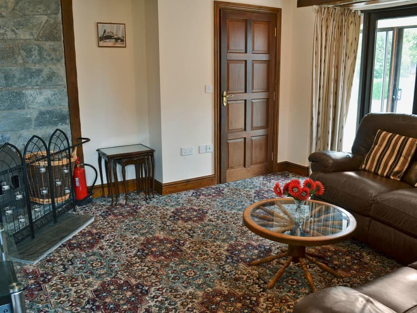 Homely living room with wood burner | Stowford Barton Cottage - Swallows Nest - Stowford Barton Cottages, Stowford, Okehampton