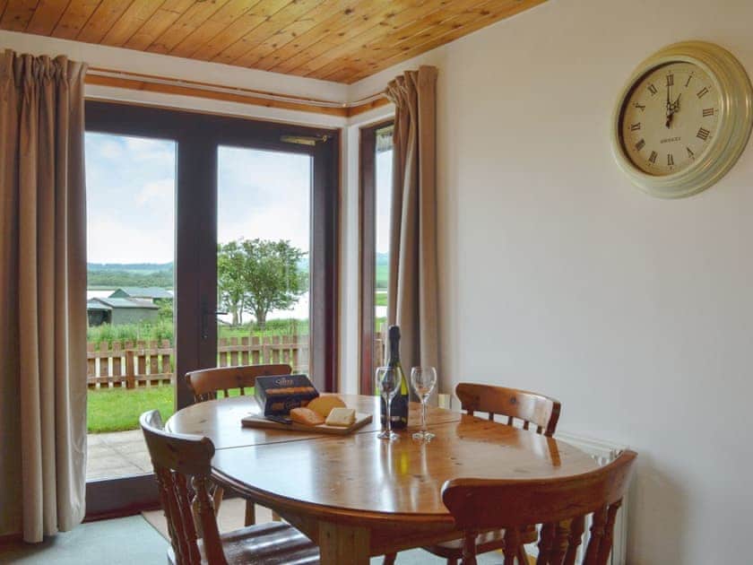 Dining area with Loch views | Silver Dee, Crossmichael, near Castle Douglas