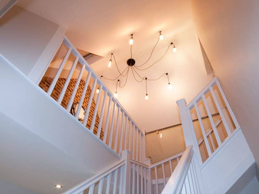 Spacious stairwell with contemporary lighting | Bank Apartment 2, Dartmouth