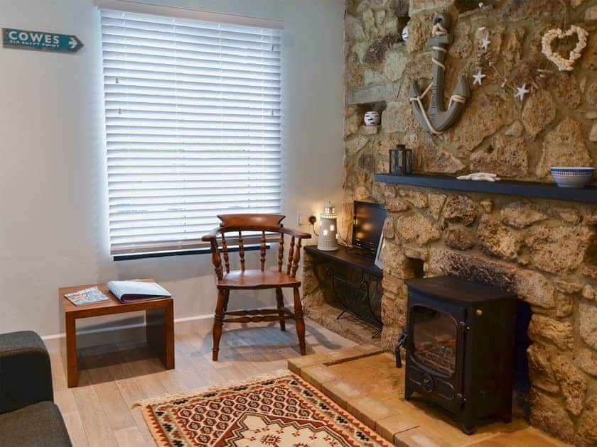 Living area with wood burner | Horseshoe Cottage, Porchfield, near Cowes