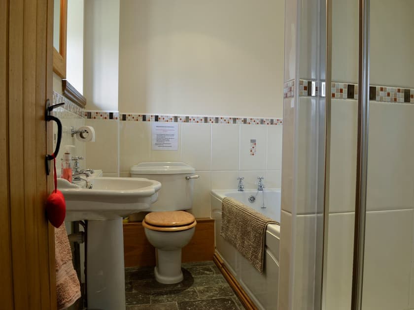 Bathroom with bath and shower cubicle  | Bwthyn Clyd, Llangollen, near Wrexham