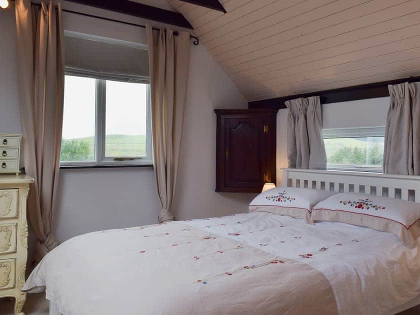 Comfortable bedroom with kingsize bed and beams | Y Teras, Rosebush, near Narberth
