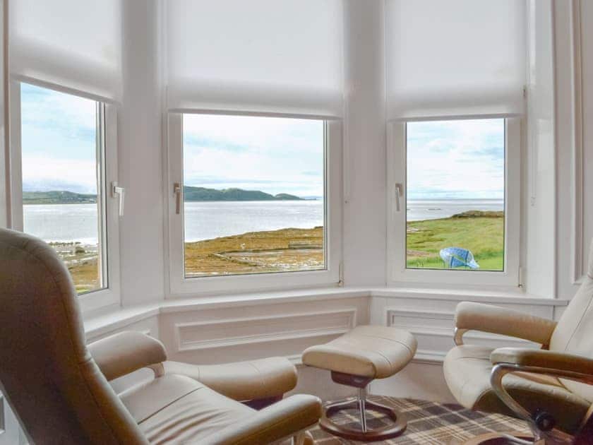 Living room with stunning views over the bay to the mountains of Arran | Thornbank, Millport, Isle of Cumbrae