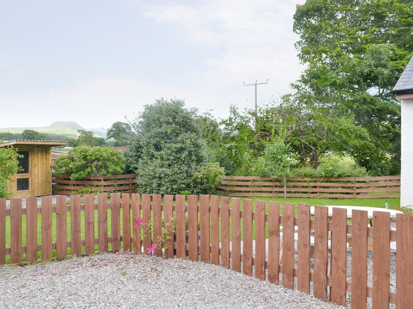 Parking area and view over garden | North Lodge Gate House, Muir of Ord