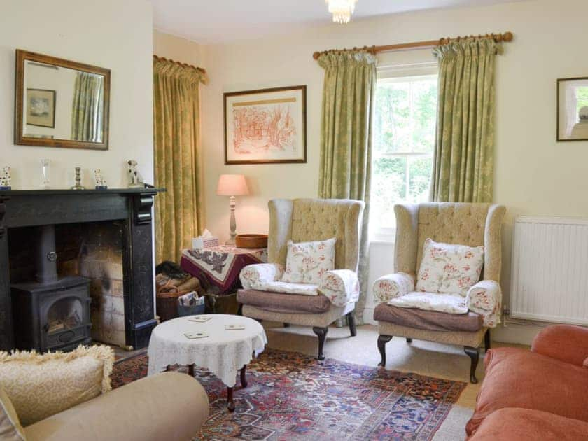 Cosy living room with wood-burning stove | Sunnybank, Newton St Margarets