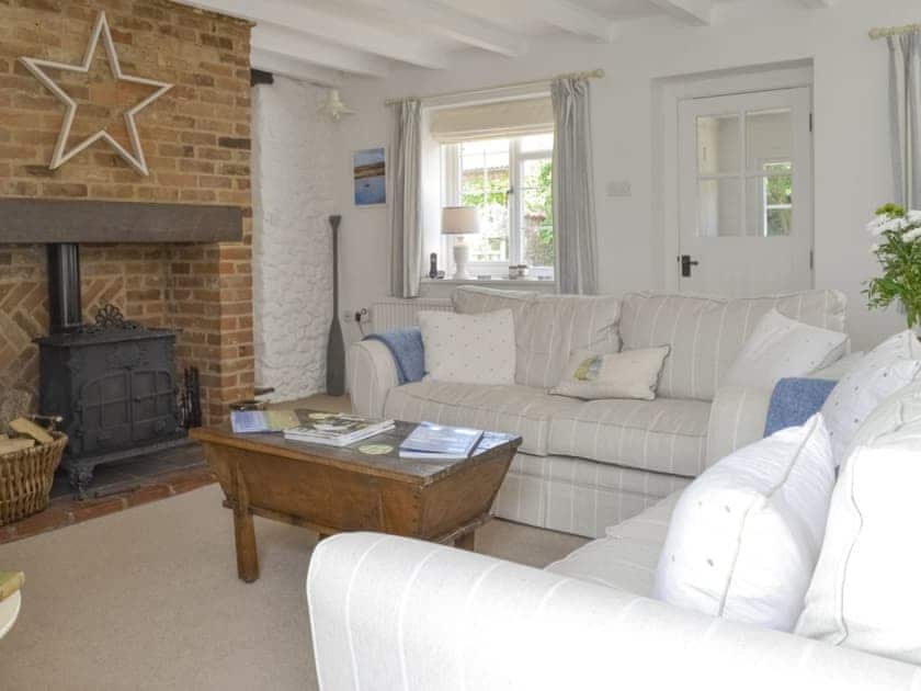 Spacious living room with feature fireplace | Mill House, Docking, near Hunstanton