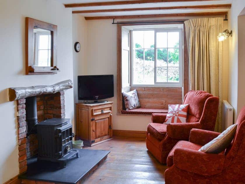 Cosy and inviting living area with woodburner | Gunluck Cottage - West End Farm Cottages, Brompton by Sawdon