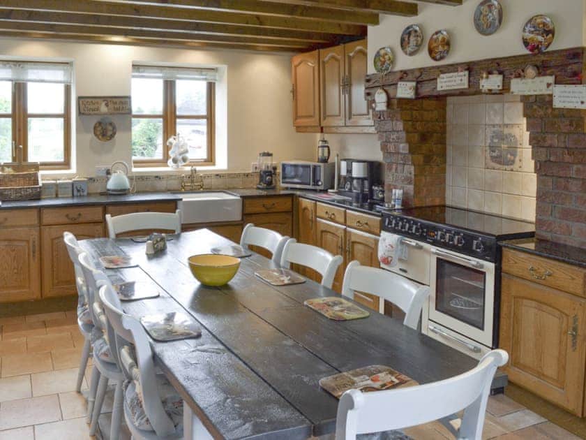 Large dining table within kitchen | Buddileigh Farm, Betley, near Nantwich
