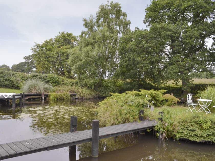 Jetty access to the island on the lake | Buddileigh Farm, Betley, near Nantwich