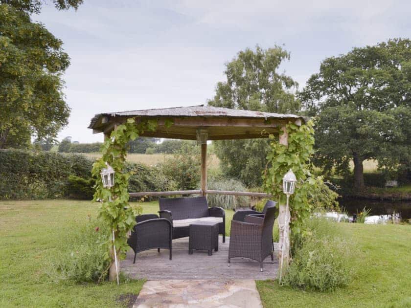 Additional outdoor seating area within garden | Buddileigh Farm, Betley, near Nantwich