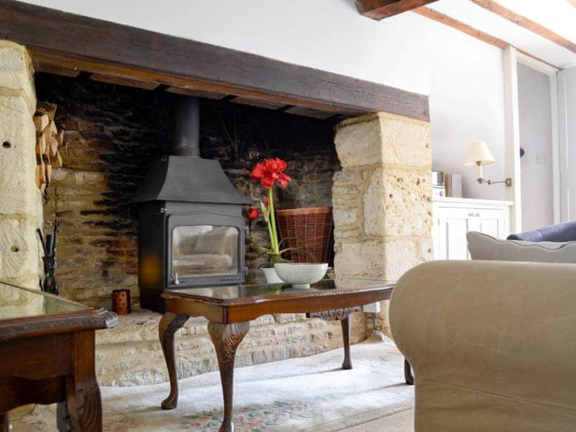 Cosy wood burner in the living room | The Old Post Office, Chedworth, near Cheltenham