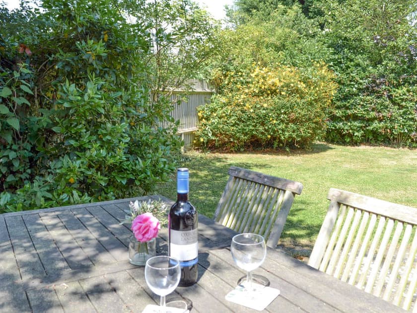 Tranquil outdoor seating area within garden | Chessons FarmStable Cottage, Wadhurst, near Tunbridge Wells