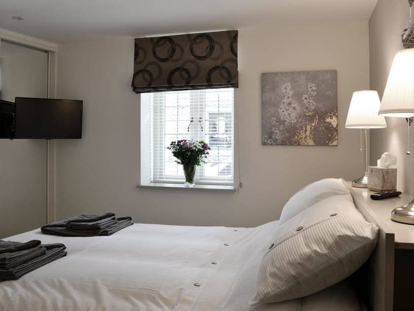 Bedroom with king size bed and Freeview TV | Back o’ the Beck, Skipton