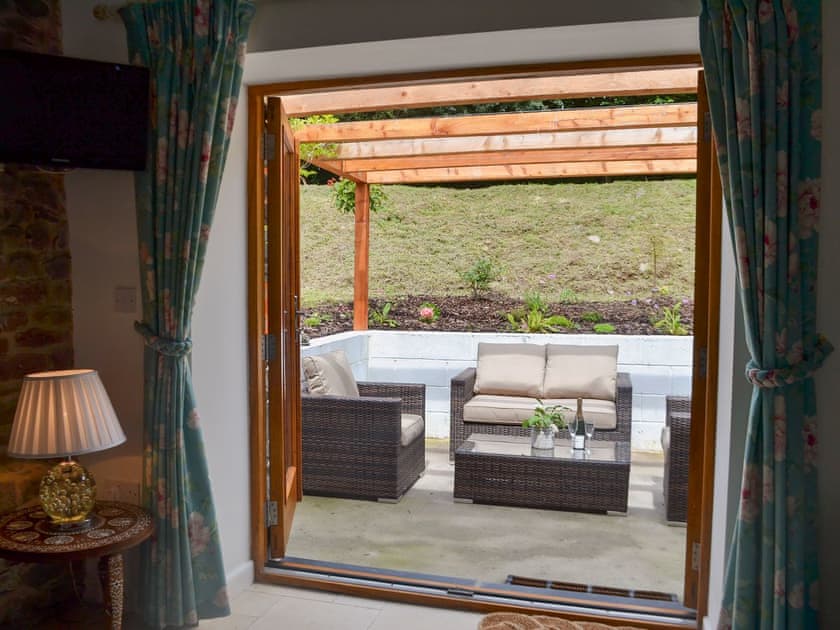 French doors leading to patio | Bramble Cottage Mountain Retreat, Llanddeusant, near Llangadog