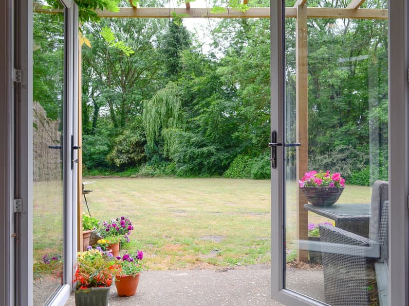 Patio doors to garden | Oakdene Lodge, Wimborne