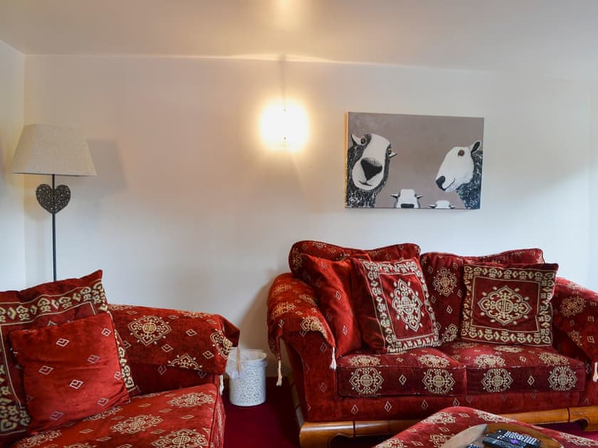 Welcoming living room with cosy wood burner | West End Cottage, Carrbridge, near Aviemore