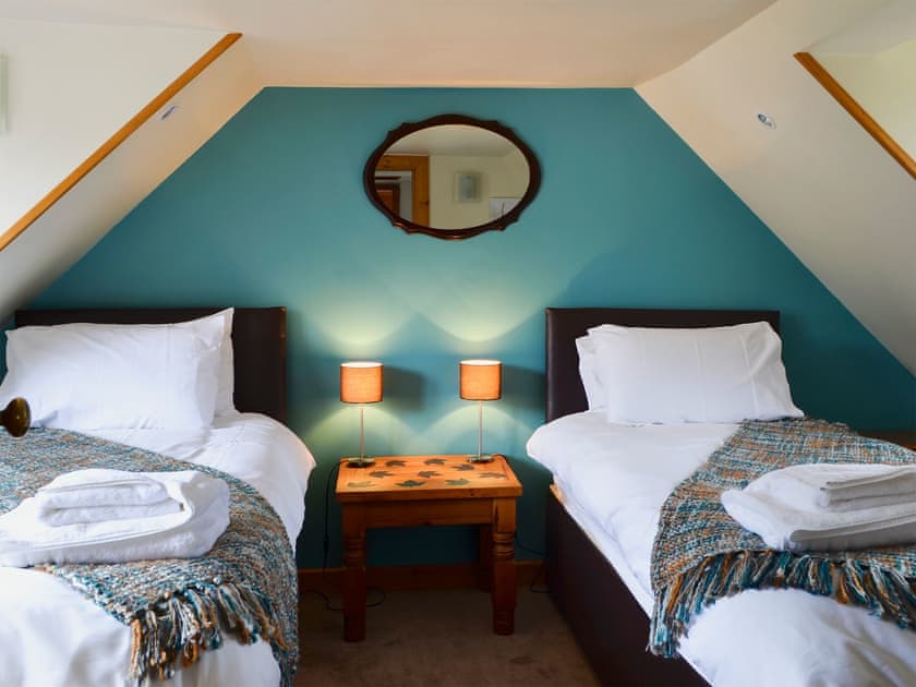 Stylishly furnished twin bedroom | West End Cottage, Carrbridge, near Aviemore