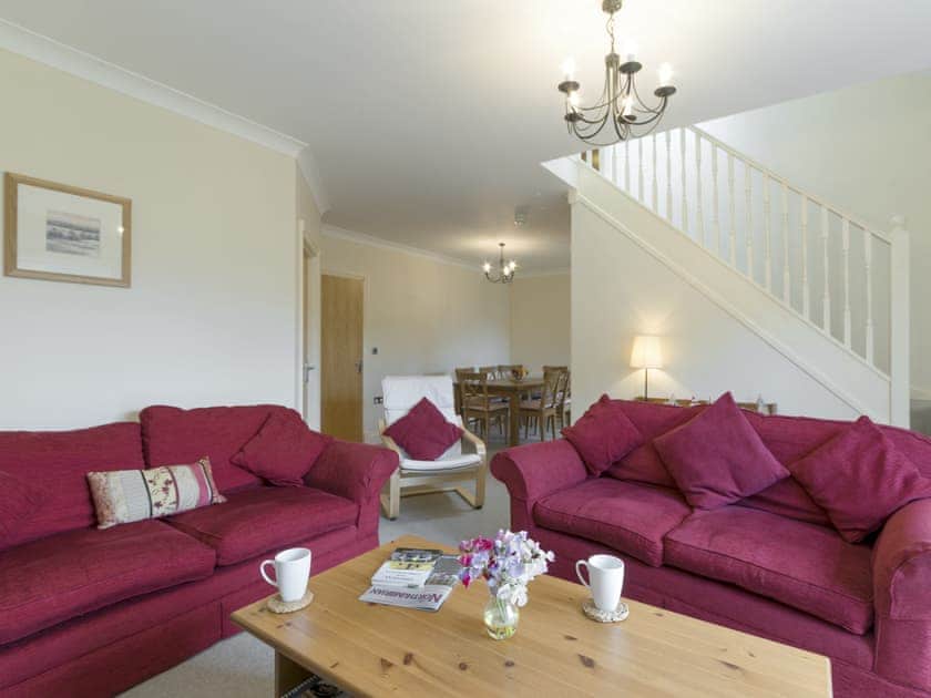 Stylish living room with open aspect to dining room | Embleton Cottage, Beadnell