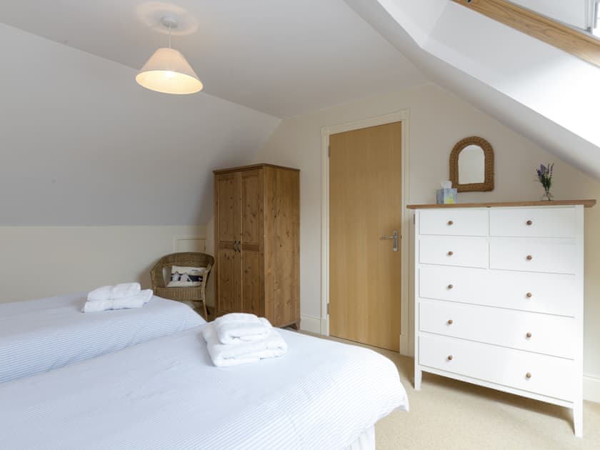 Ample storage within twin bedroom | Embleton Cottage, Beadnell