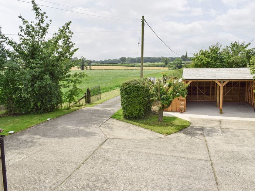 View from first floor over the parking areas and beyond | Glebe Farm Cottage, Hornby