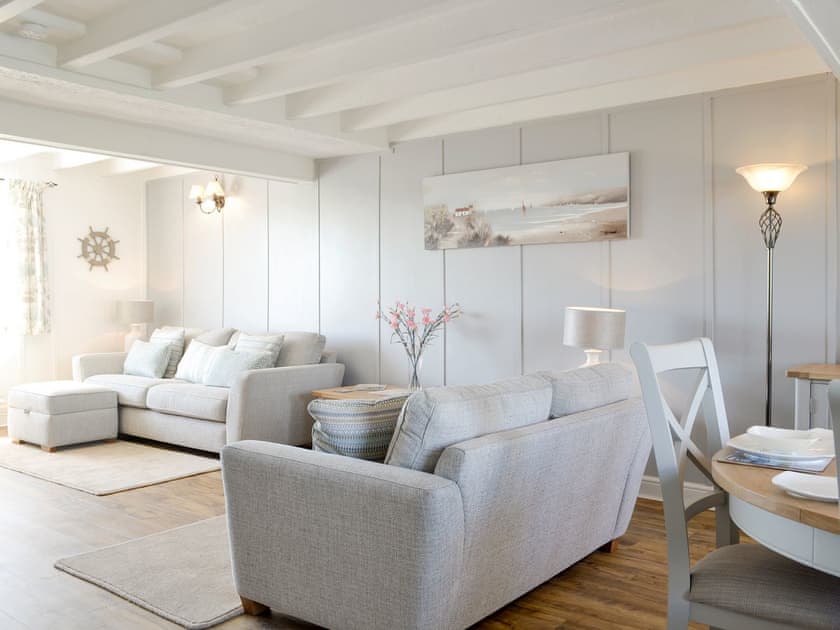 Comfy seating within living and dining room | Bwthyn Y Borth, Rhoscolyn, near Holyhead