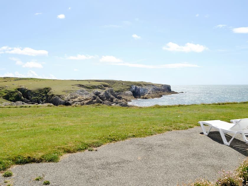 Panoramic coastal views from the patio | Bwthyn Y Borth, Rhoscolyn, near Holyhead