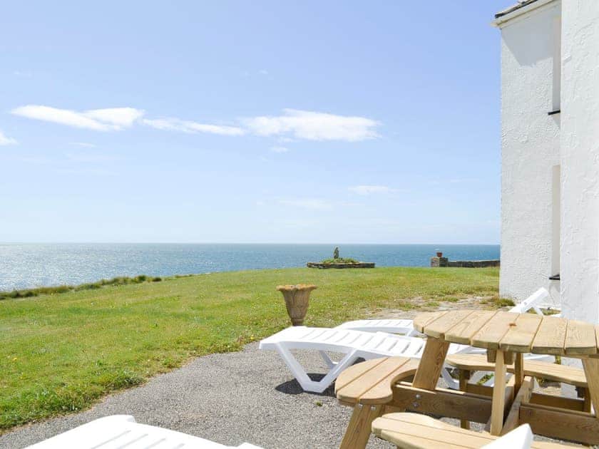 A range of outdoor furniture on the patio area | Bwthyn Y Borth, Rhoscolyn, near Holyhead