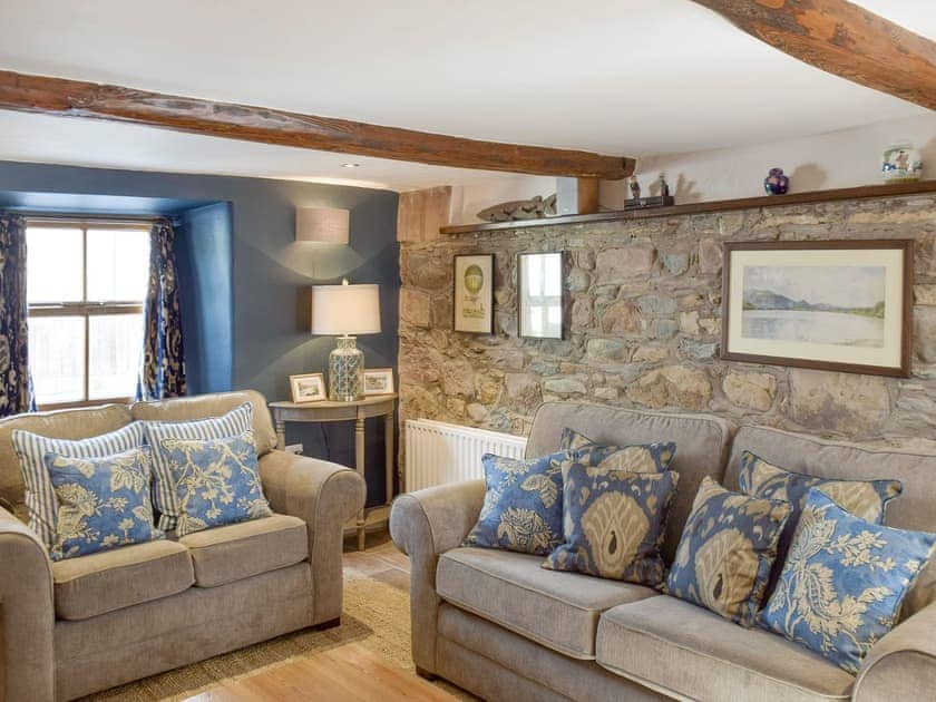Exposed stone feature wall in comfy living room | Windy Nook, Pooley Bridge