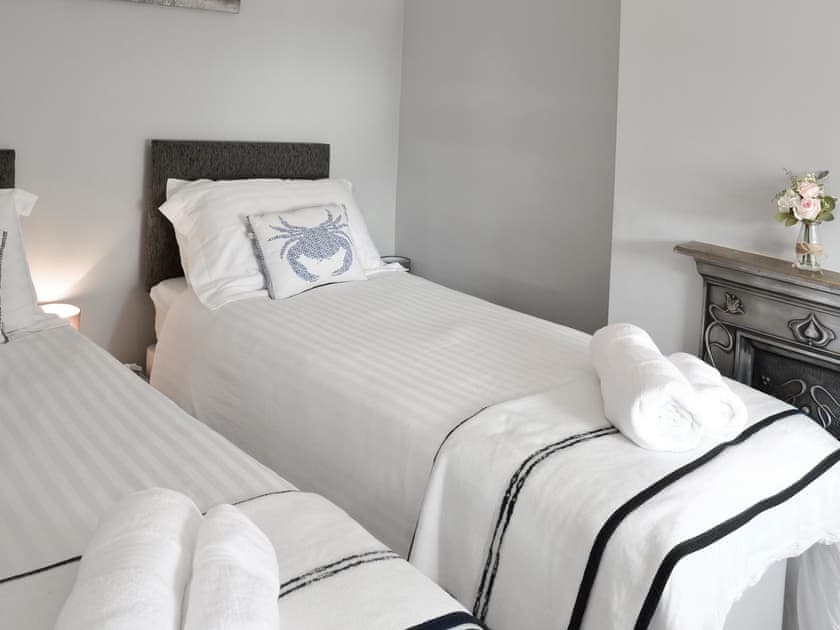 Tranquil bedroom with zip and link beds | Morvoren (Sea Maiden) Cottage, The Lizard Village, near Helston