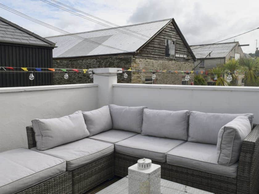 Sunny decked area with glimpse of the water | Aloft, Salcombe