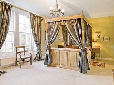 Four Poster bedroom | Lochside Stable House, Yetholm, nr. Kelso