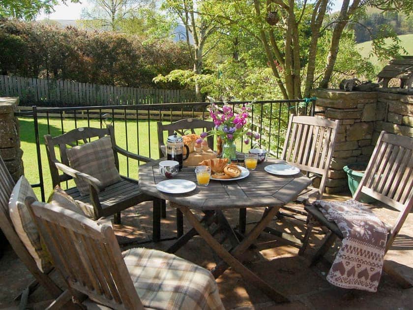 Relaxing sitting-out-area withfurniture | Garden Cottage - Hole House Farm Cottages, Pooley Bridge, nr. Ullswater