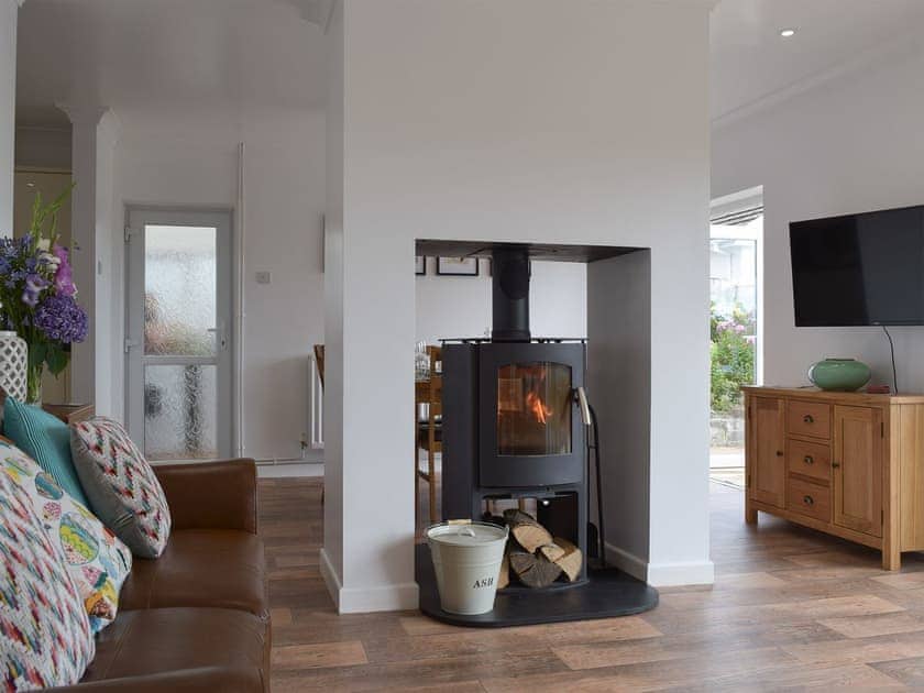Open plan living space with wood burner | Caldey View, Near Stepaside, Saundersfoot